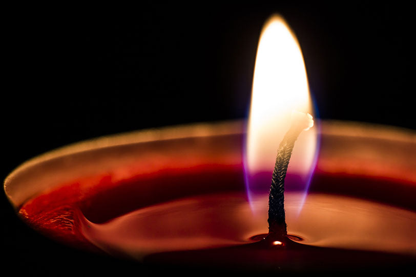 closeup view burning candle wick