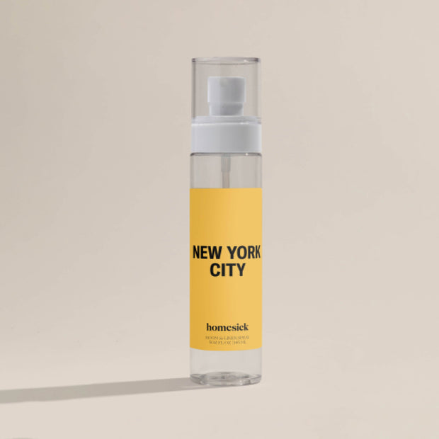 A product shot of the New York City Linen/Room Spray shot on a dark cream background.