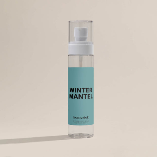 The Winter Mantel Room Spray shot on a dark cream background.