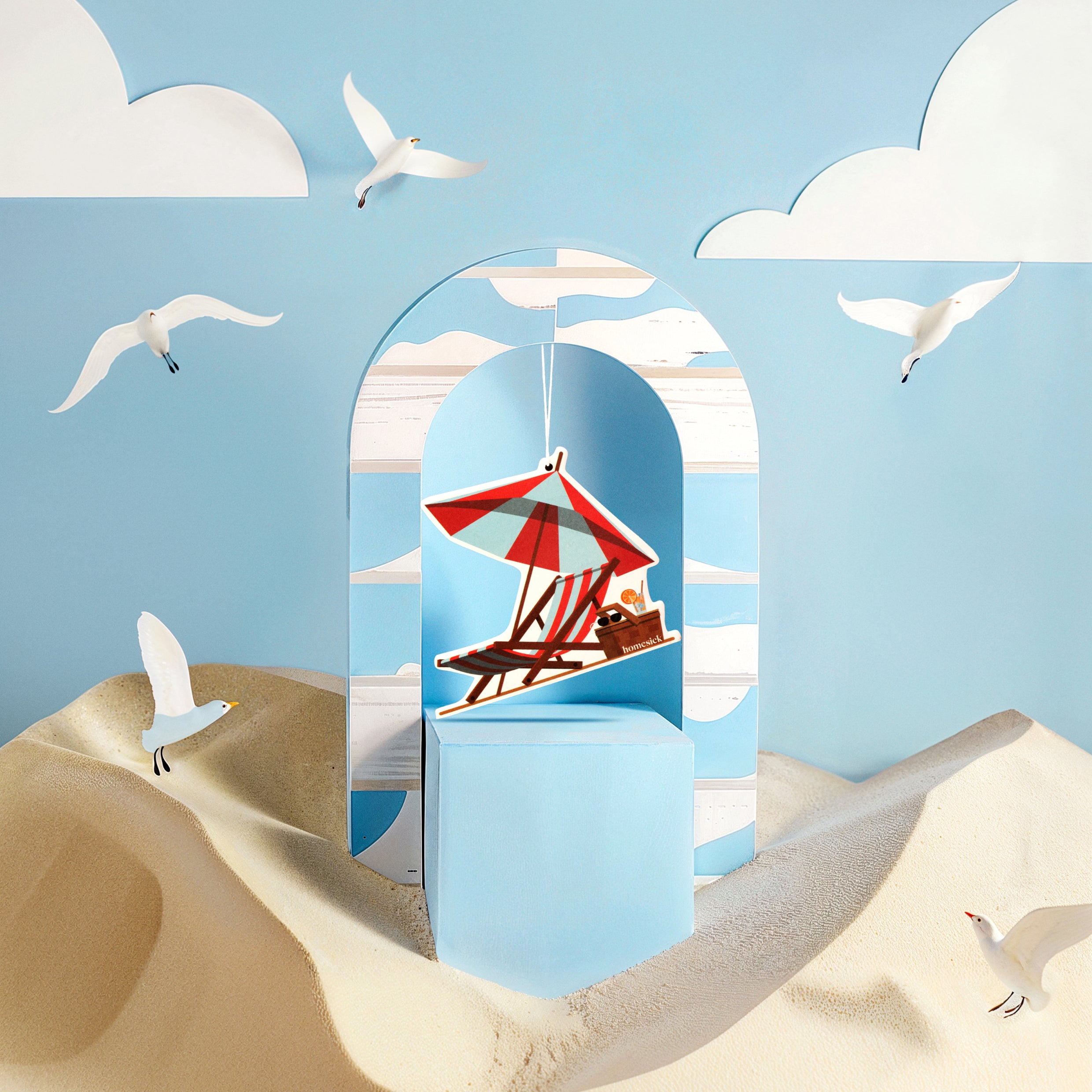 Lifestyle image of car freshener in a stylized beach scene