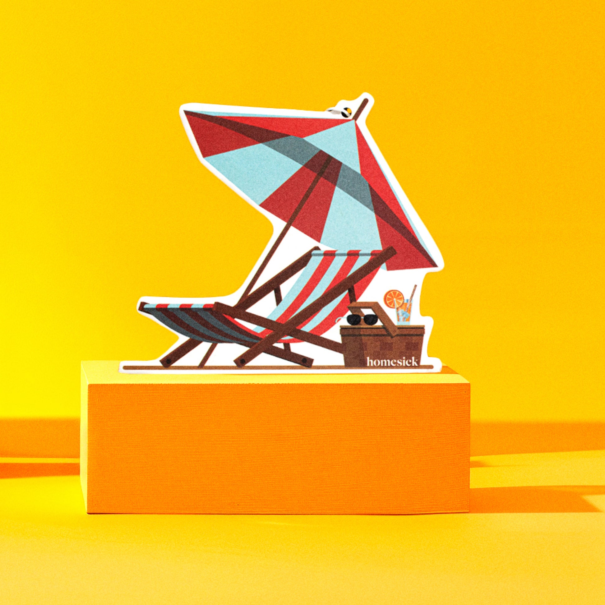 Lifestyle image of a car freshener in an abstract scene