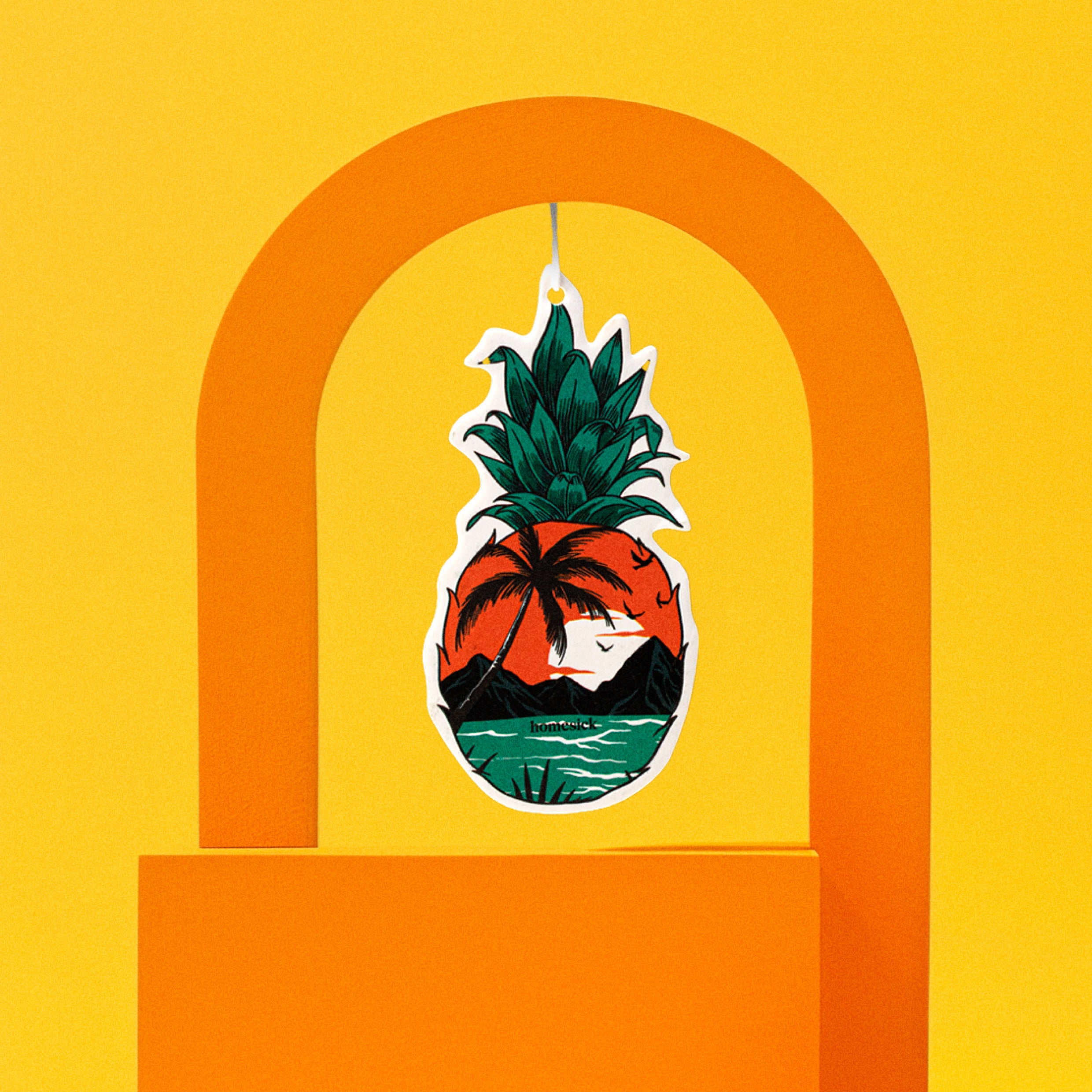 Lifestyle image of a car freshener in an abstract scene