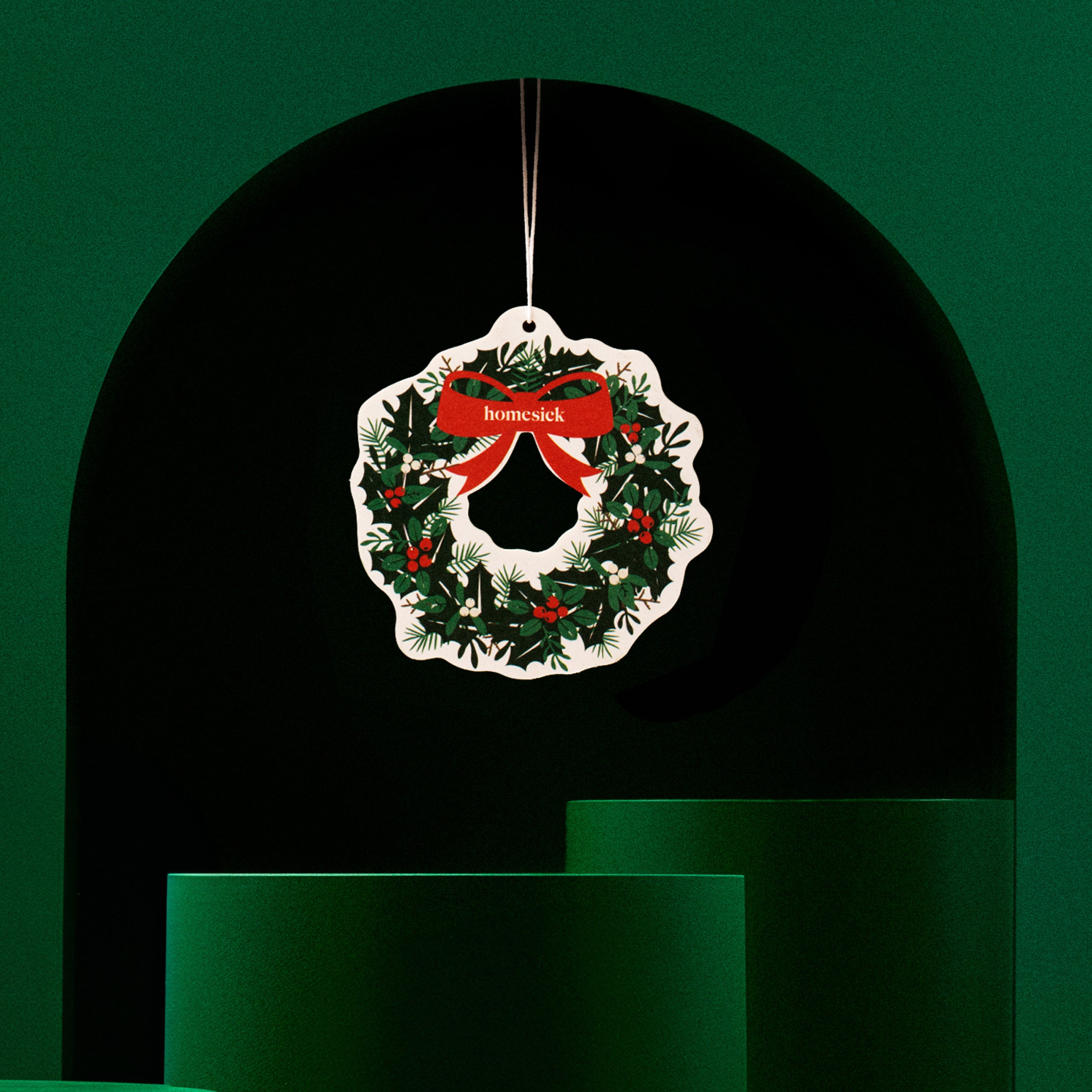 Car freshener on a green decorative background
