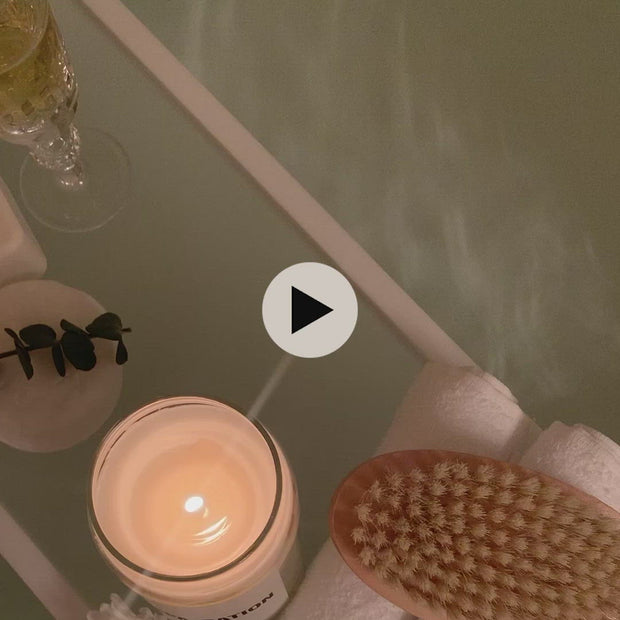 Video of the spa-cation candles on a bath catty over a bath with relaxing spa like music. 