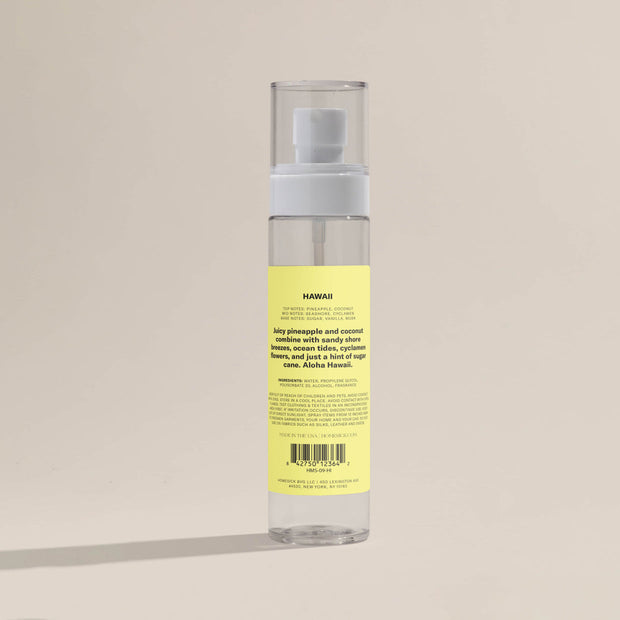 A bottle of the Hawii Room Spray that shows the back packaging.