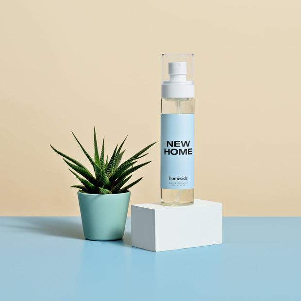 A product shot of the New Home Room Spray.