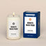 A lit Minute Maid Park Homesick candle displayed next to its boxed packaging on a dark cream background.