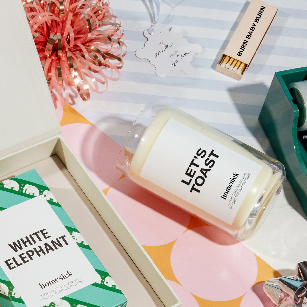 A stylized shot of the various Homesick candles and matches as a gift box.