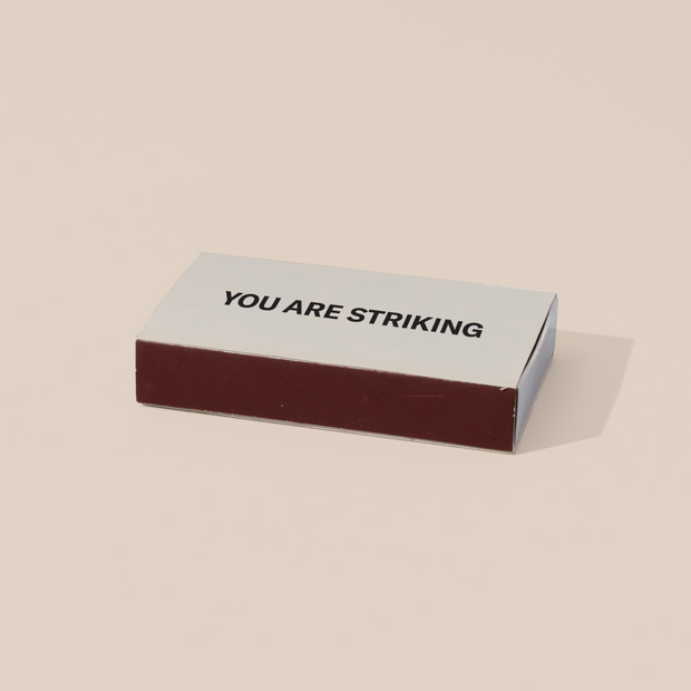 A box of "You Are Striking" oversized matches. 
