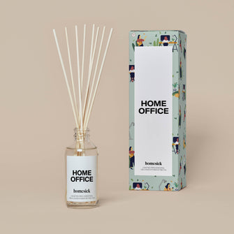 The Home Office Reed Diffuser and its packaging shot in a dark cream background.