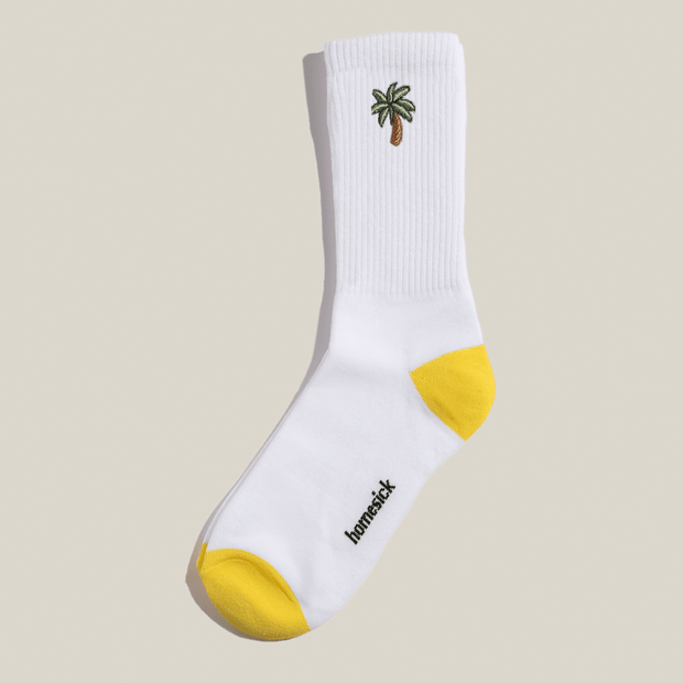 An image of the high rise socks that have a palm icon on them.