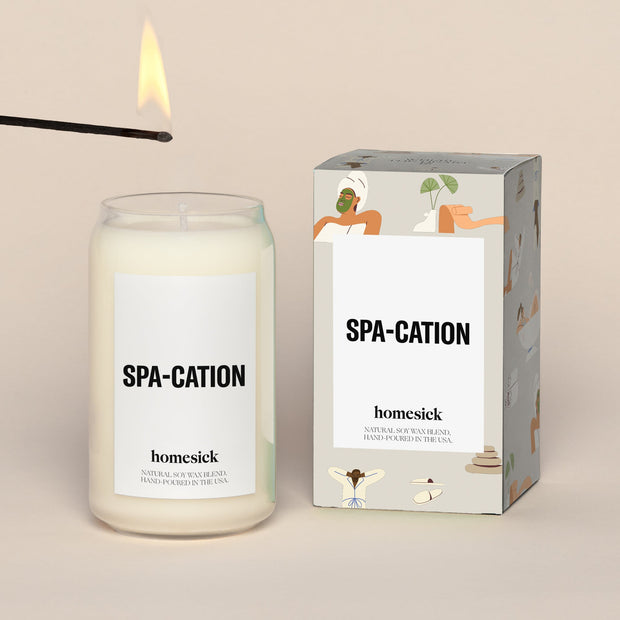 Single spa-cation candle next to a the packing box. The packing box is a white box with an over pattern of spa like animation.