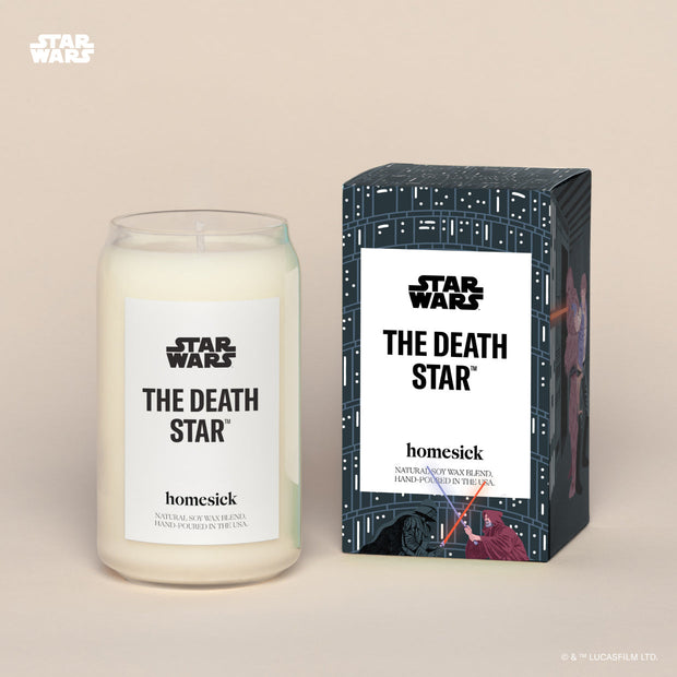A Death Star Homesick candle displayed next to its boxed packaging on a dark cream background.