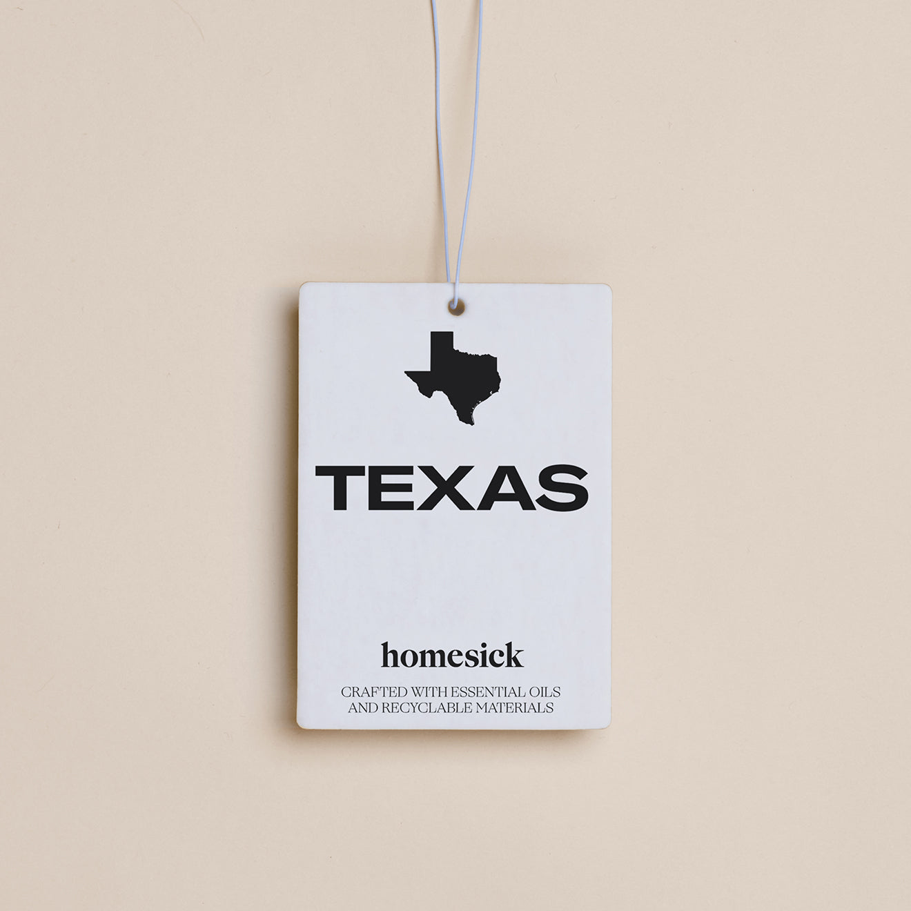 The Texas Car Freshener displayed on a dark cream background.